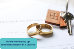 wedding rings, car keys, and a wooden house - a concept for Divvying up Sentimental Items in a Divorce