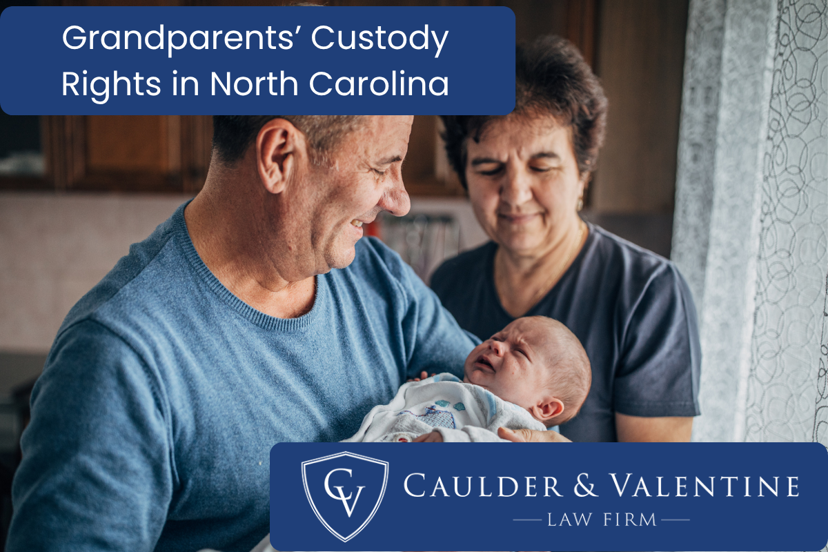 grandparents carrying their grandson