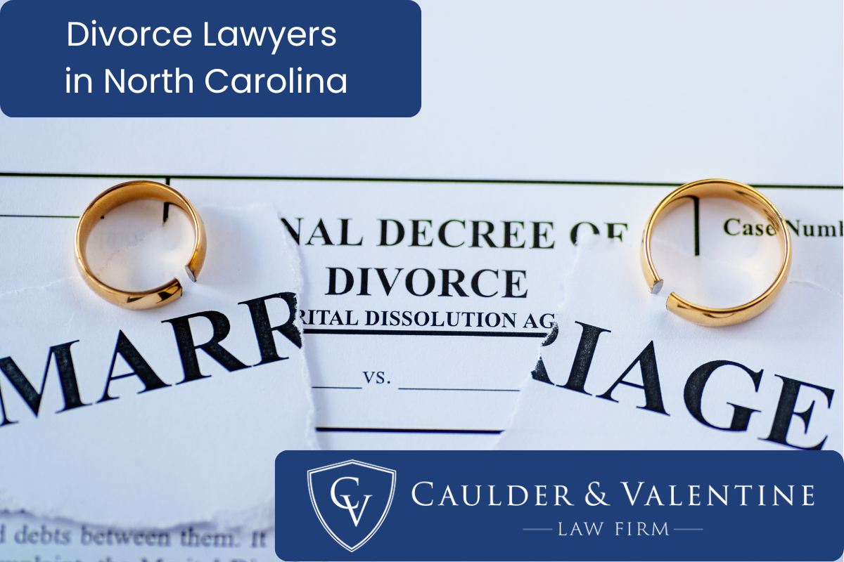 wedding rings and a torn paper with marriage written on - a concept for divorce lawyer in North Carolina